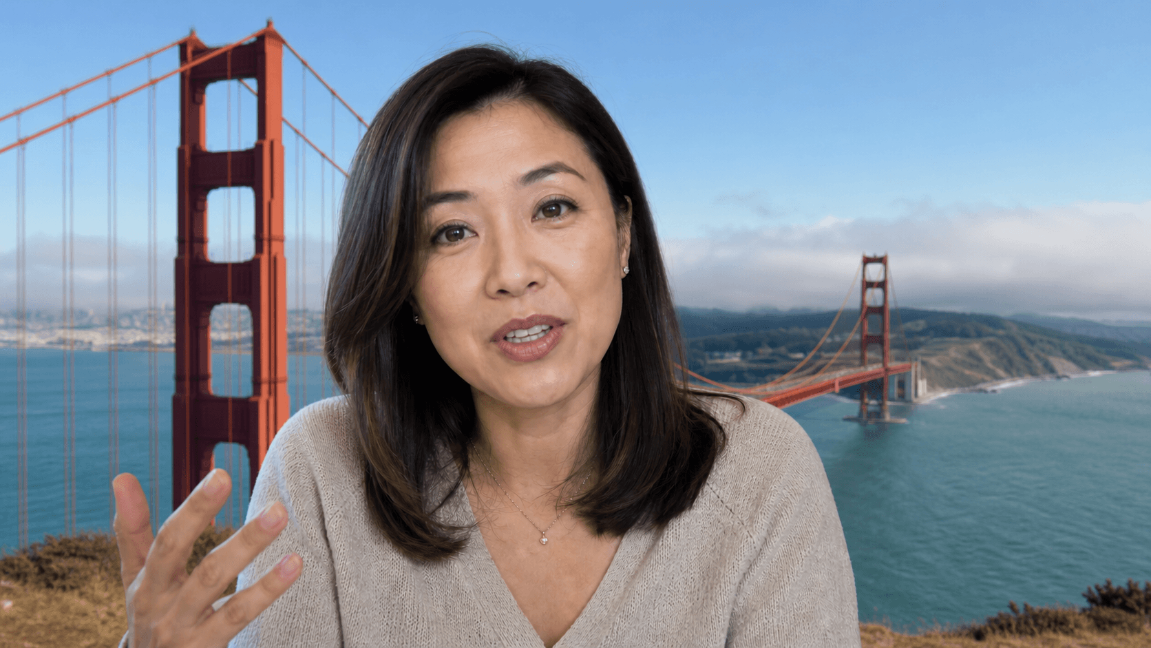 Maya Chen speaking in a minimized interview call with a Golden Gate Bridge virtual background